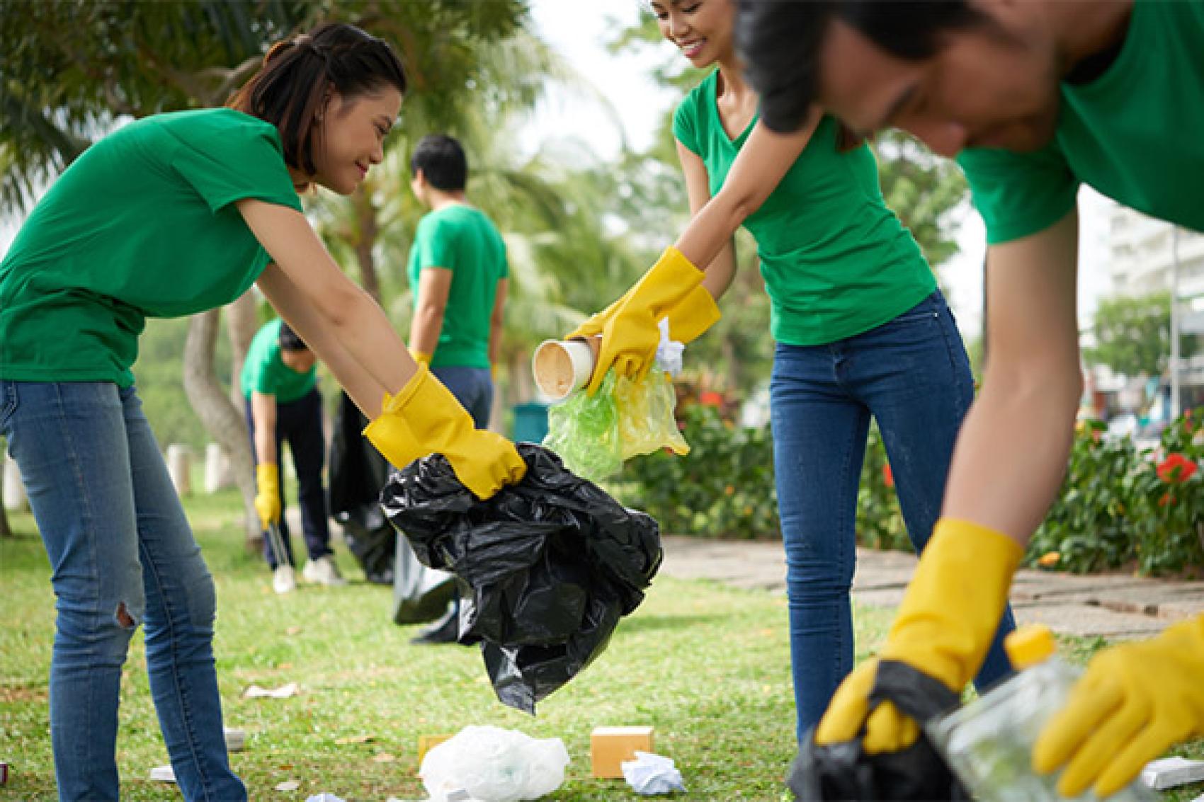 stock photo of volunteers picking up trash