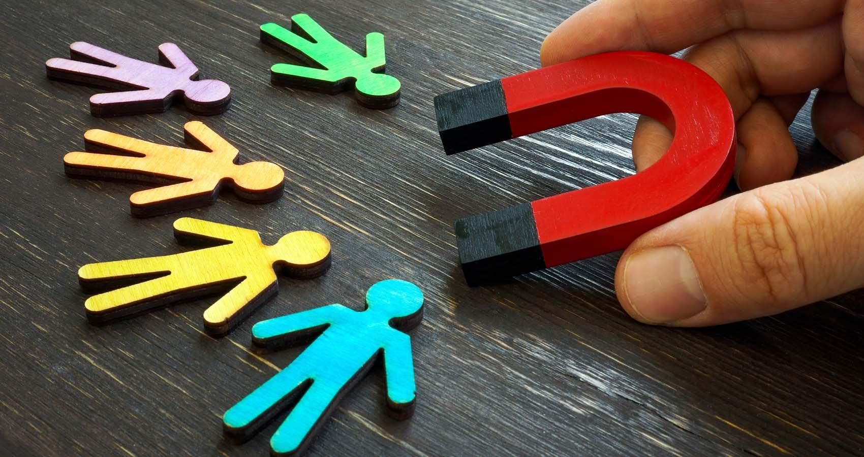 magnet attracting cut outs of people