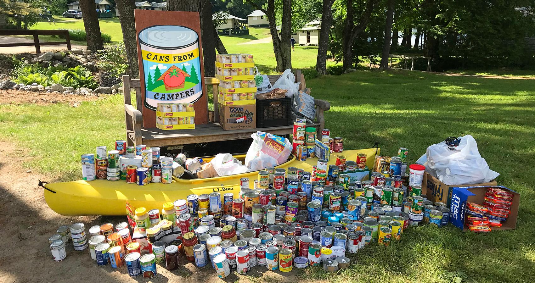 canned goods stacked in canoe and table